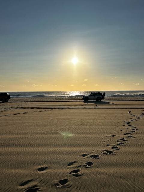 Bronco Beach Bash car parade at sunrise