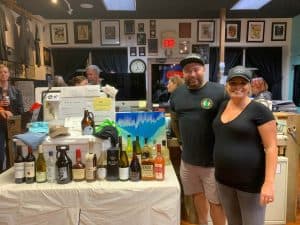Justin & Brittney Acita of Pickles with Yeti cooler & prizes at Independent Tattoo