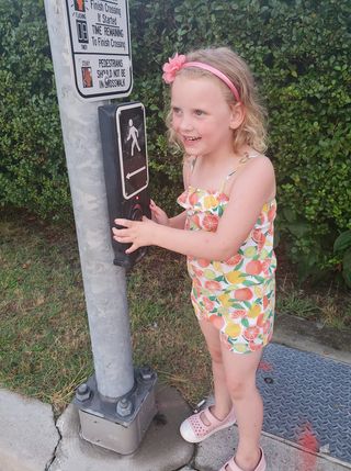 child waiting at cross walk in ocean city md