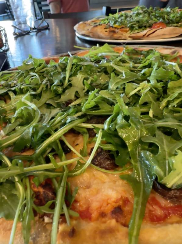 arugula on pizzas at shottis point lunas