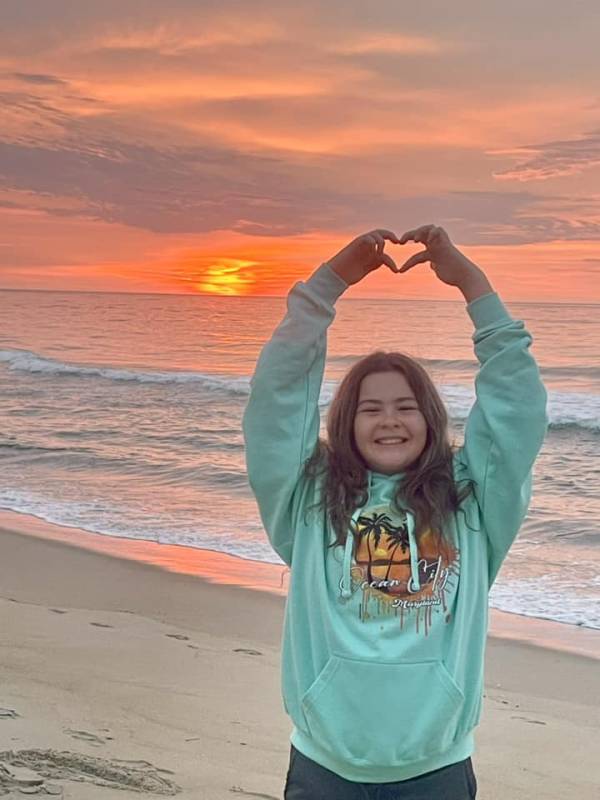 Girl on beach for sunrise in ocean city md