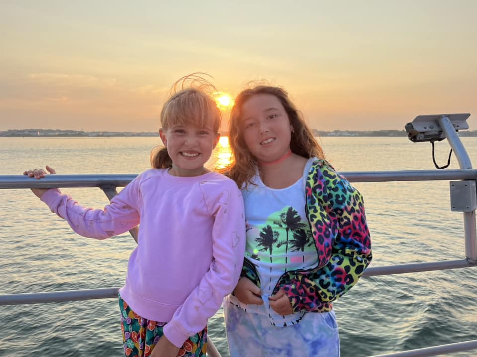 Two girls enjoying a Sunset cruise in Ocean City Md
