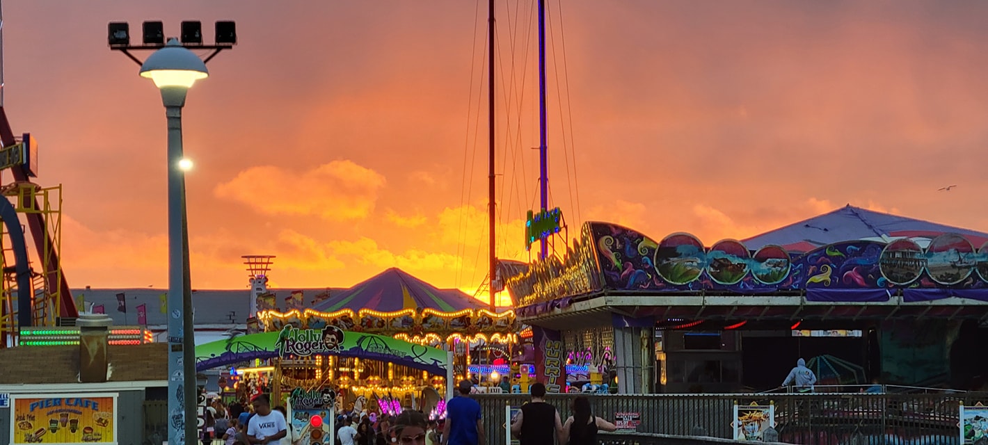sunset on the ocean city boardwalk