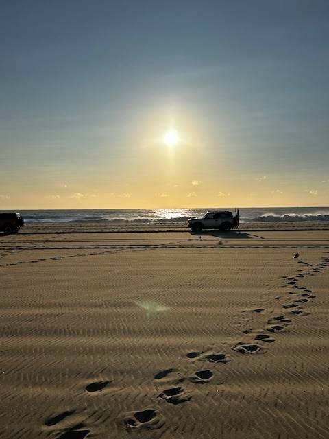 Bronco Beach Bash car parade at sunrise