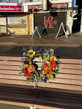 Fall decorated memorial boardwalk bench