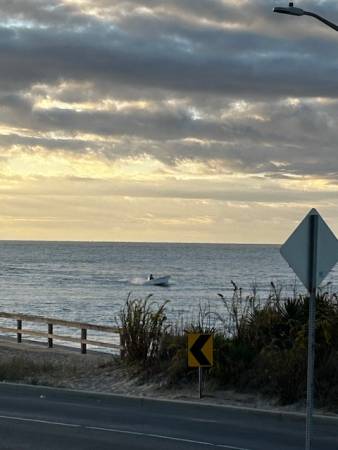 Boater coming through OC inlet