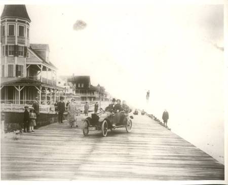 old photo with car on boardwalk