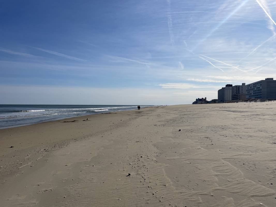 quiet beach with couple in ocean city Md