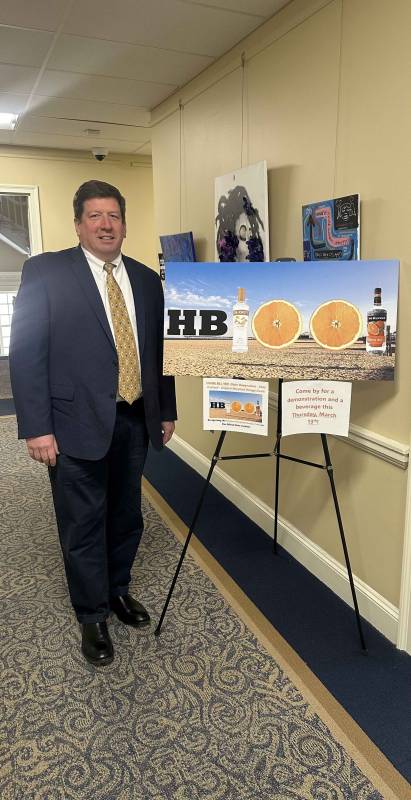Delegate Wayne Hartman with poster promoting HB 1001