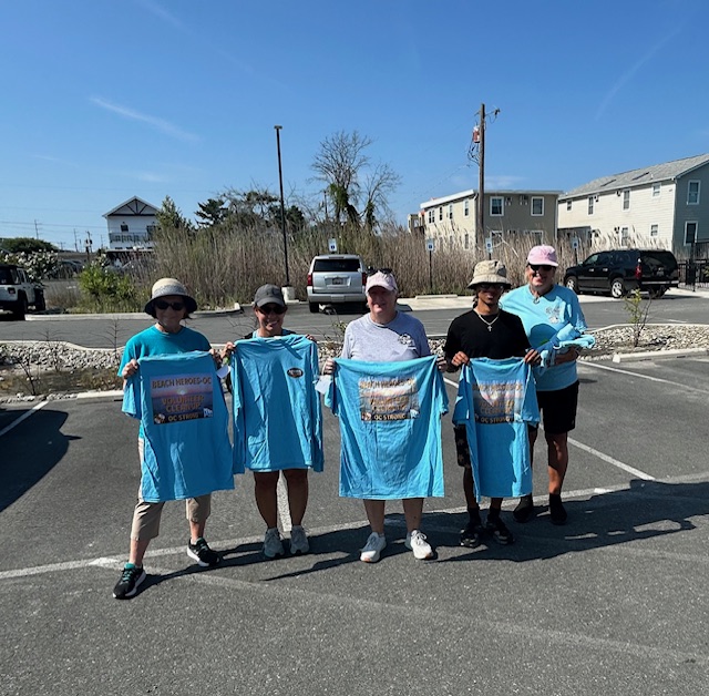 Volunteers receiving their award shirts