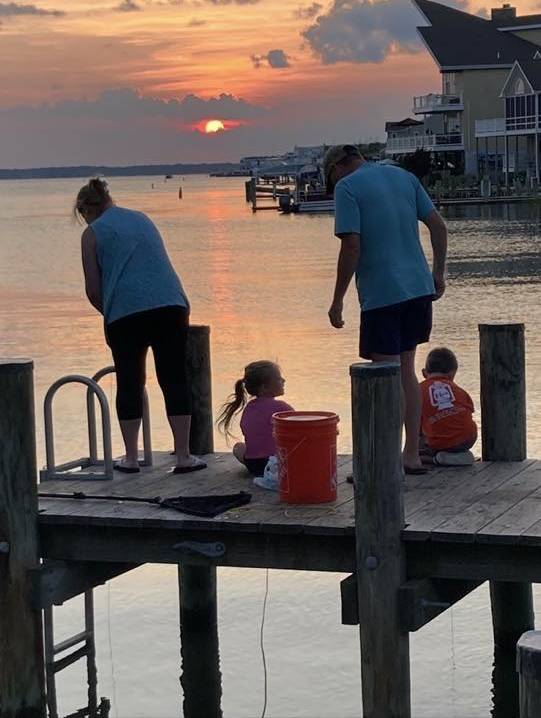 photo Friday Carol Winter Bowling My son his wife and my 2 grandchildren crabbing at sunset July 22 2025