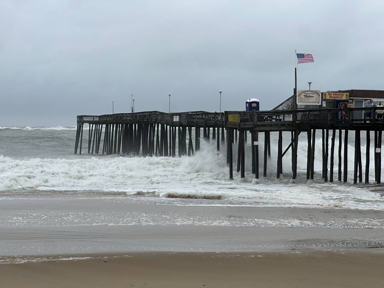 Waves from Hurricane Erin crash into the Ocean City pier