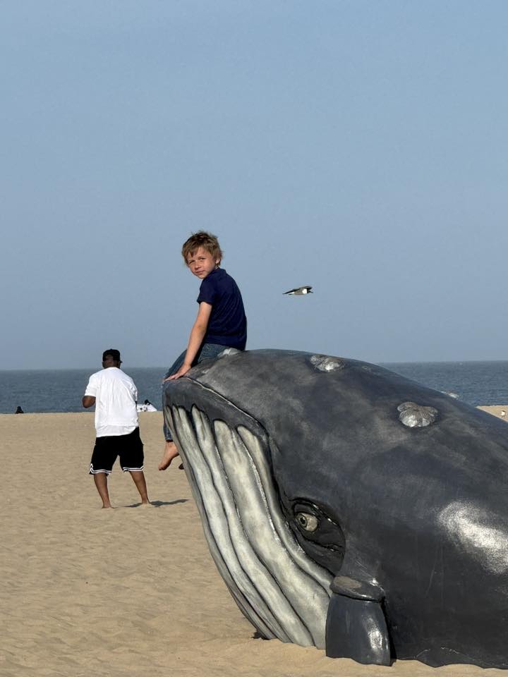 Photo Friday Kayla Mercede Atkinson My oldest son Hayden sitting on the whale statue on the beach we were there for a day trip
