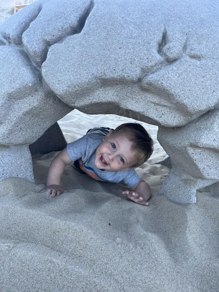 Photo Friday Lara Agostinelli He LOVES the beach! Enjoying the Dino bones on our last day of vacation