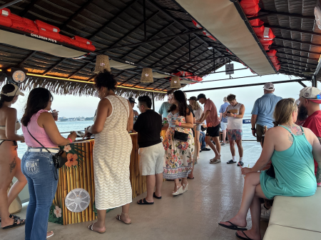 Guests enjoying drinks on a Seacrets Cruise in Ocean City md