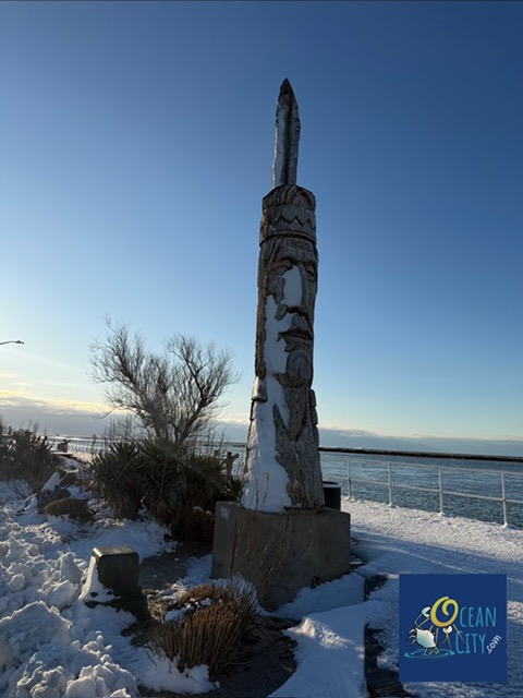 snow on native american sculpture at inlet