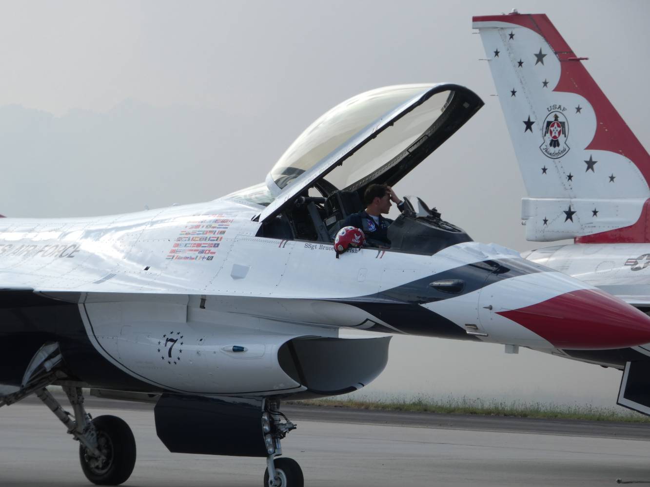 plane 7 from the usaf thunderbirds - canopy open and pilot readying to disembark